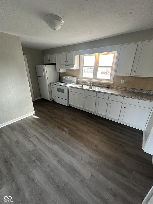 kitchen featuring white appliances, dark wood-style floors, and white cabinets