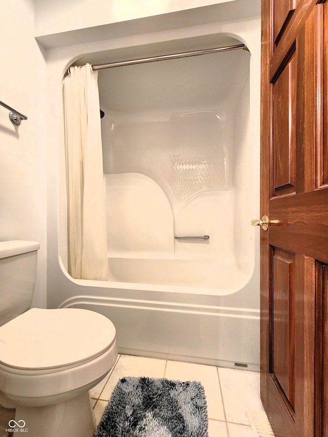 bathroom with tile patterned floors, toilet, and shower / bathtub combination with curtain