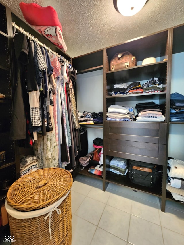 spacious closet with tile patterned flooring