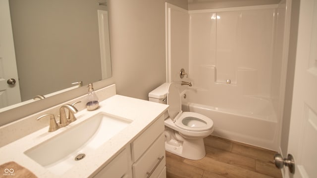 2349 S Copperstone Dr, New Palestine, IN 46163 - bathroom featuring toilet, vanity, wood finished floors, and shower / bath combination
