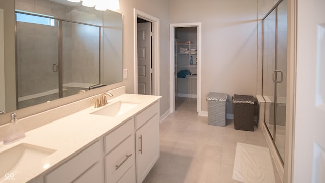 2349 S Copperstone Dr, New Palestine, IN 46163 - full bath with double vanity, a shower stall, tile patterned flooring, and a sink