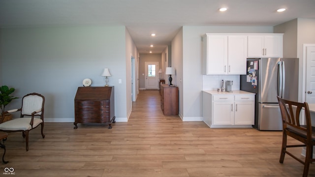 2349 S Copperstone Dr, New Palestine, IN 46163 - kitchen featuring light wood-type flooring, baseboards, freestanding refrigerator, recessed lighting, and white cabinetry