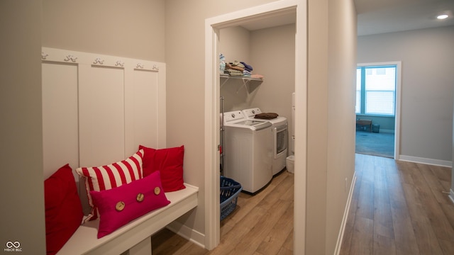 2349 S Copperstone Dr, New Palestine, IN 46163 - washroom with separate washer and dryer, baseboards, light wood-style floors, and laundry area