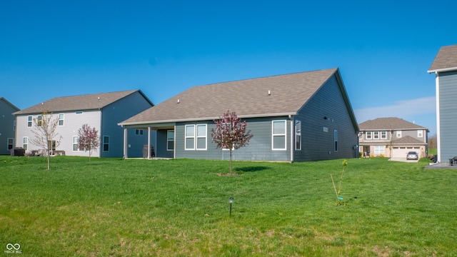 2349 S Copperstone Dr, New Palestine, IN 46163 - rear view of property with roof with shingles and a yard