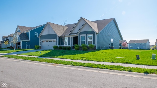 2349 S Copperstone Dr, New Palestine, IN 46163 - craftsman-style home featuring board and batten siding, driveway, a front yard, and a garage
