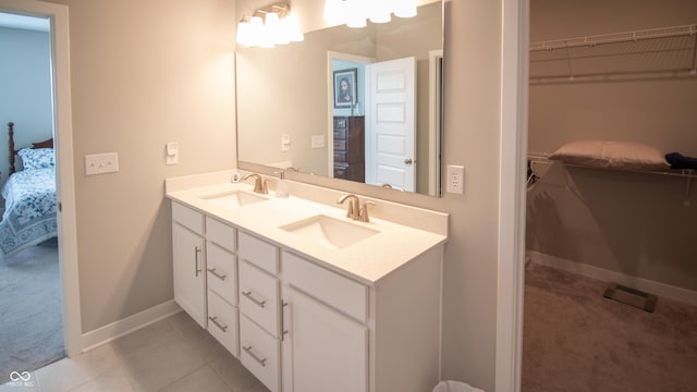 2349 S Copperstone Dr, New Palestine, IN 46163 - full bath featuring baseboards, a sink, double vanity, and ensuite bathroom