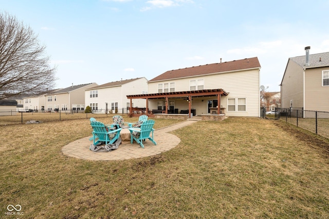 back of house with a patio, a lawn, and a fenced backyard