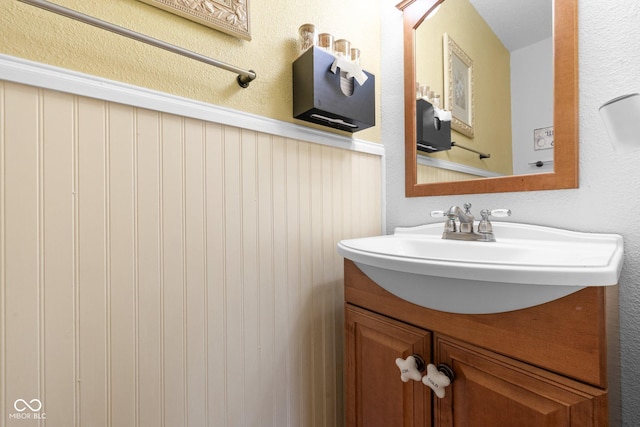 bathroom featuring vanity and wainscoting