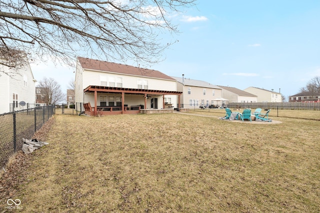 back of property featuring a patio area, a lawn, and a fenced backyard