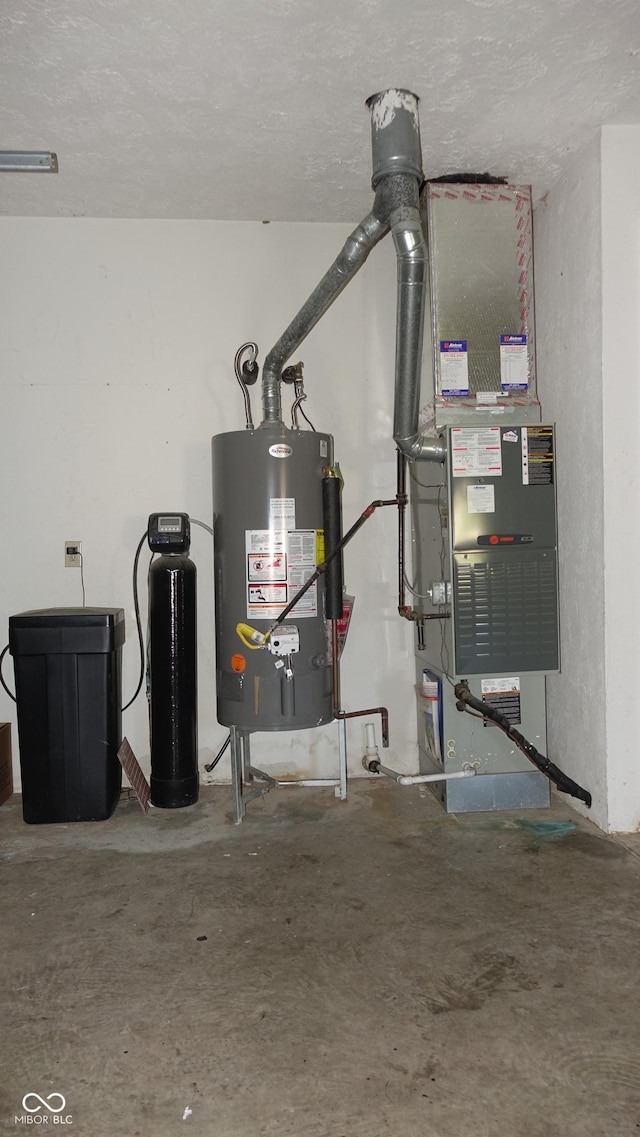 utility room featuring water heater and heating unit