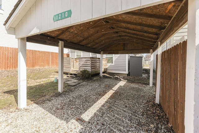 view of car parking with fence