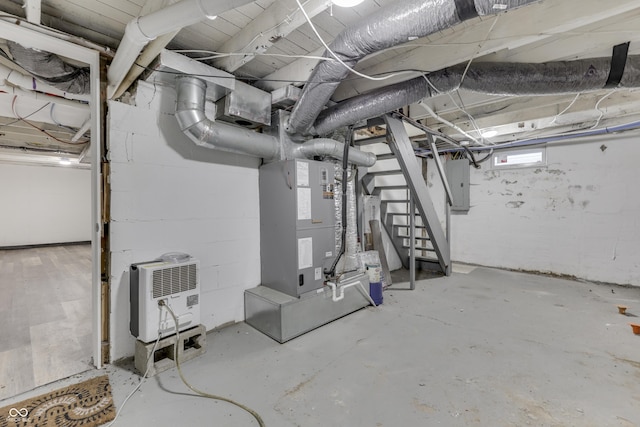 basement with heating unit and electric panel