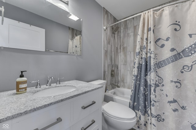 bathroom with shower / tub combo with curtain, vanity, and toilet