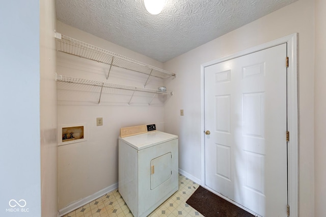 laundry area featuring washer / dryer, laundry area, baseboards, and light floors