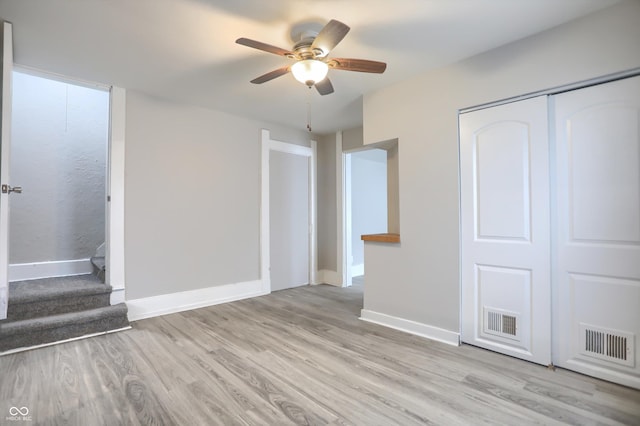 interior space featuring visible vents, baseboards, and light wood-style floors