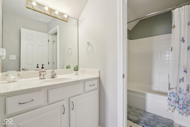 full bathroom with vanity, lofted ceiling, and shower / bathtub combination with curtain