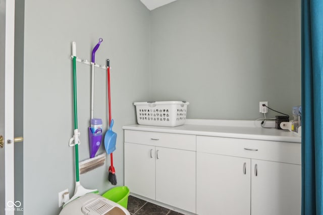 clothes washing area featuring tile patterned flooring