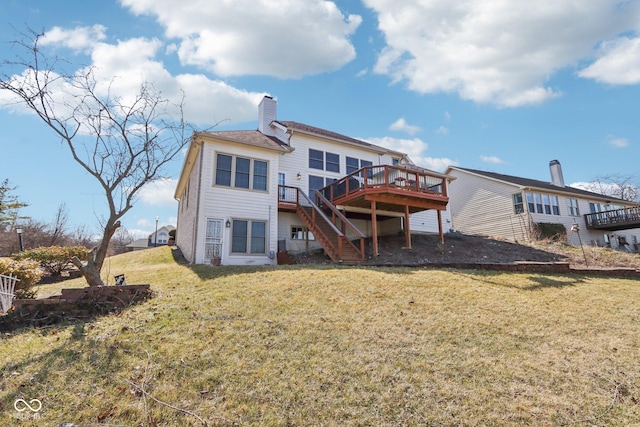 back of house with stairway, a yard, a chimney, and a wooden deck