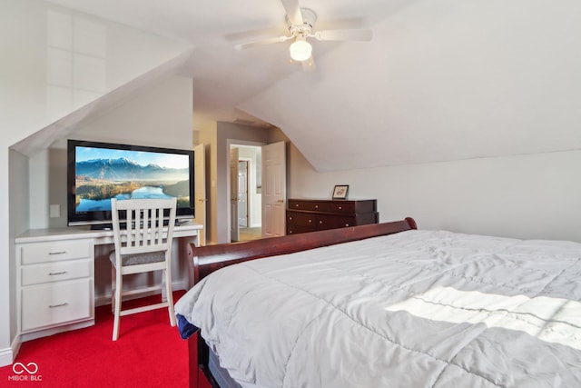 bedroom featuring lofted ceiling, ceiling fan, carpet flooring, and built in study area