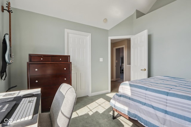 bedroom with carpet flooring, baseboards, and vaulted ceiling