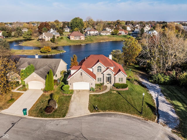 aerial view featuring a residential view and a water view