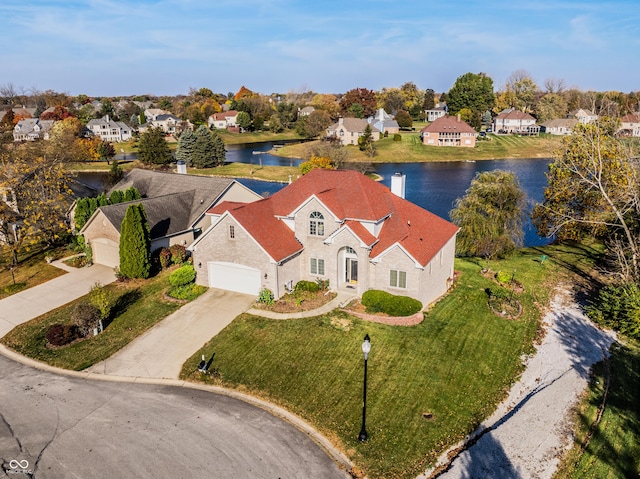 birds eye view of property featuring a residential view and a water view