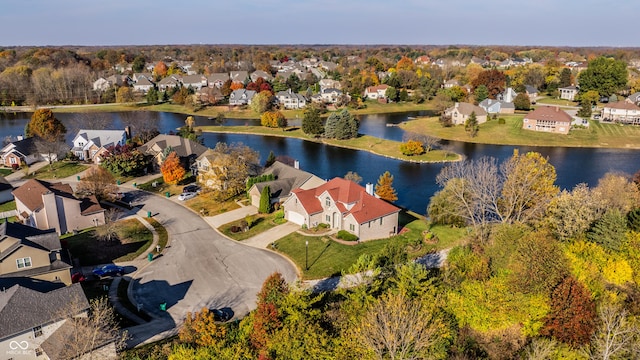 bird's eye view featuring a residential view and a water view