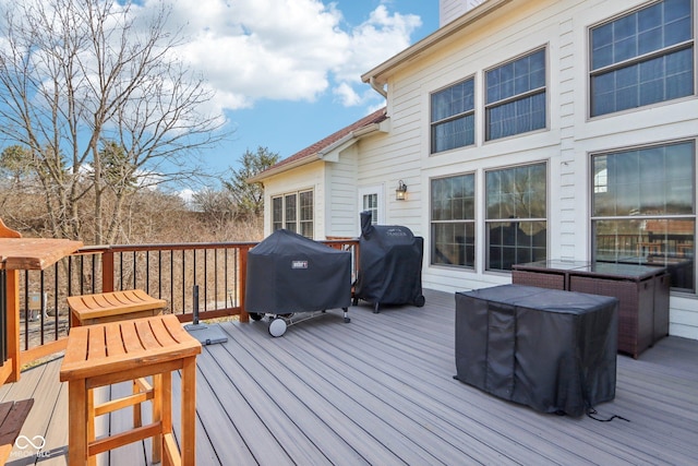 wooden terrace featuring grilling area