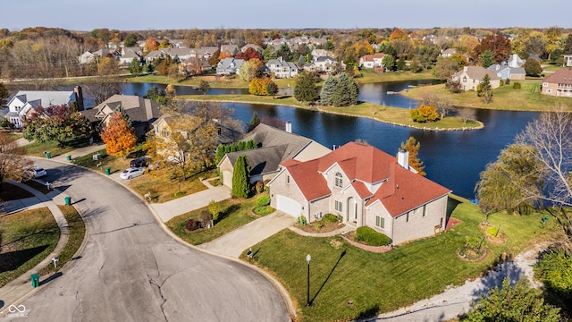 birds eye view of property with a residential view and a water view