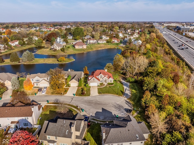 birds eye view of property with a residential view and a water view