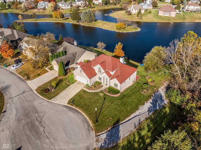 aerial view with a residential view and a water view