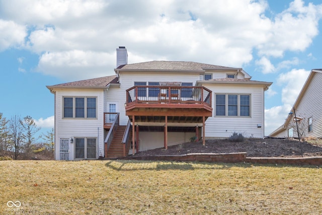 rear view of house featuring stairway, a lawn, a deck, and a chimney