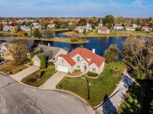 birds eye view of property featuring a residential view and a water view