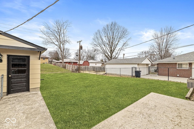 view of yard featuring an outbuilding and a fenced backyard