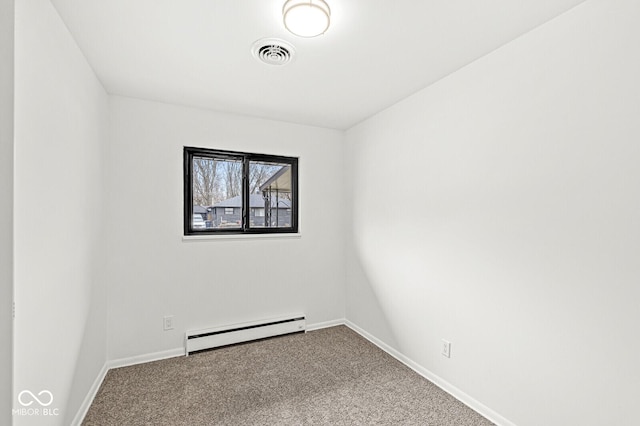 carpeted spare room featuring baseboards, visible vents, and baseboard heating