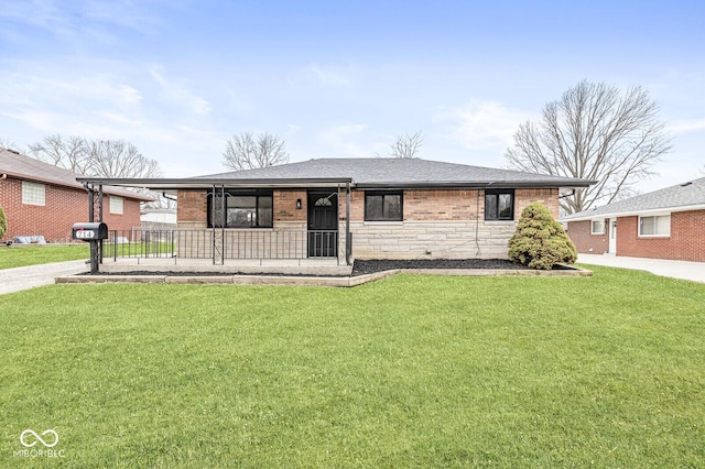 single story home featuring a front yard, covered porch, a shingled roof, stone siding, and brick siding