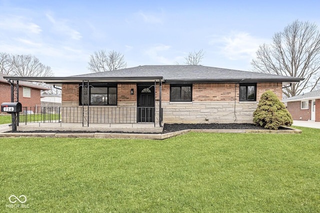 ranch-style house with a front yard, brick siding, stone siding, and a shingled roof