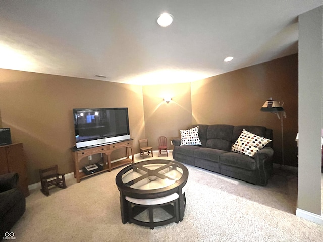 carpeted living area featuring baseboards and recessed lighting