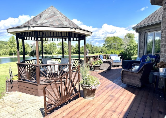 wooden deck featuring an outdoor hangout area, a gazebo, outdoor dining space, and a water view