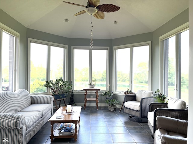 sunroom / solarium with lofted ceiling and a ceiling fan