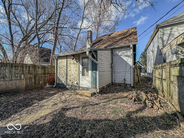 view of outbuilding featuring a fenced backyard