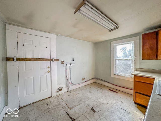 interior space featuring laundry area and light floors