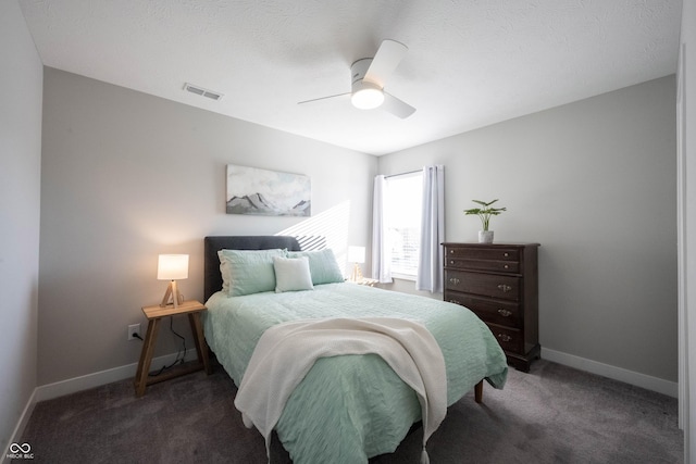 carpeted bedroom featuring visible vents, a ceiling fan, and baseboards