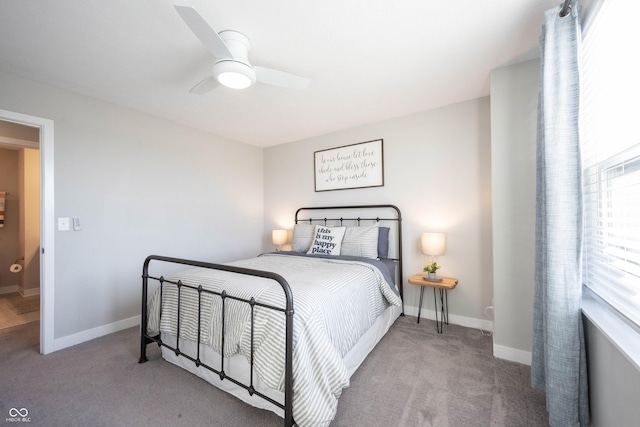 bedroom featuring ceiling fan, baseboards, and carpet