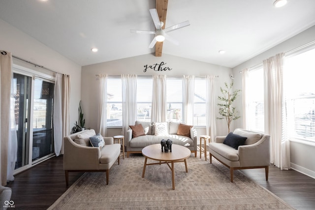 interior space with a ceiling fan, lofted ceiling with beams, wood finished floors, and a wealth of natural light