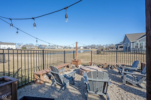 view of yard featuring a fire pit and fence