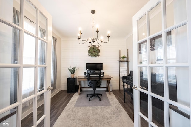 office space featuring an inviting chandelier, wood finished floors, and french doors