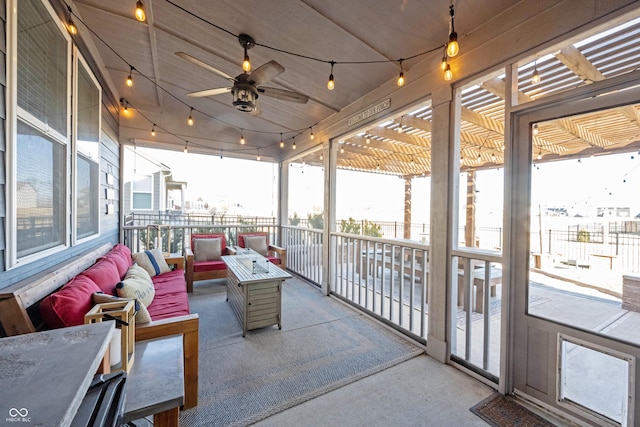 exterior space with rail lighting and a ceiling fan