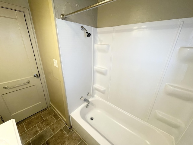 full bathroom featuring baseboards and shower / washtub combination