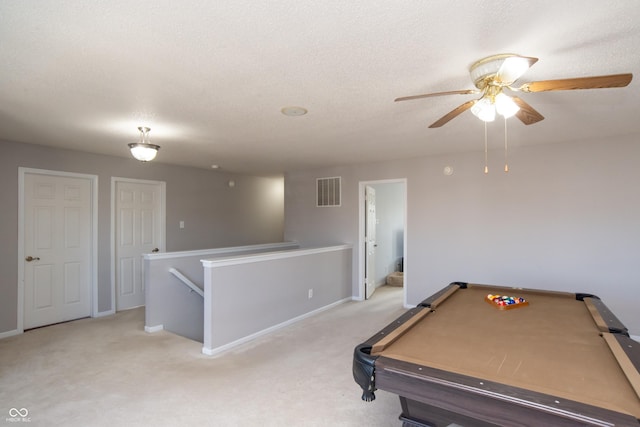 playroom featuring visible vents, a ceiling fan, light colored carpet, pool table, and a textured ceiling